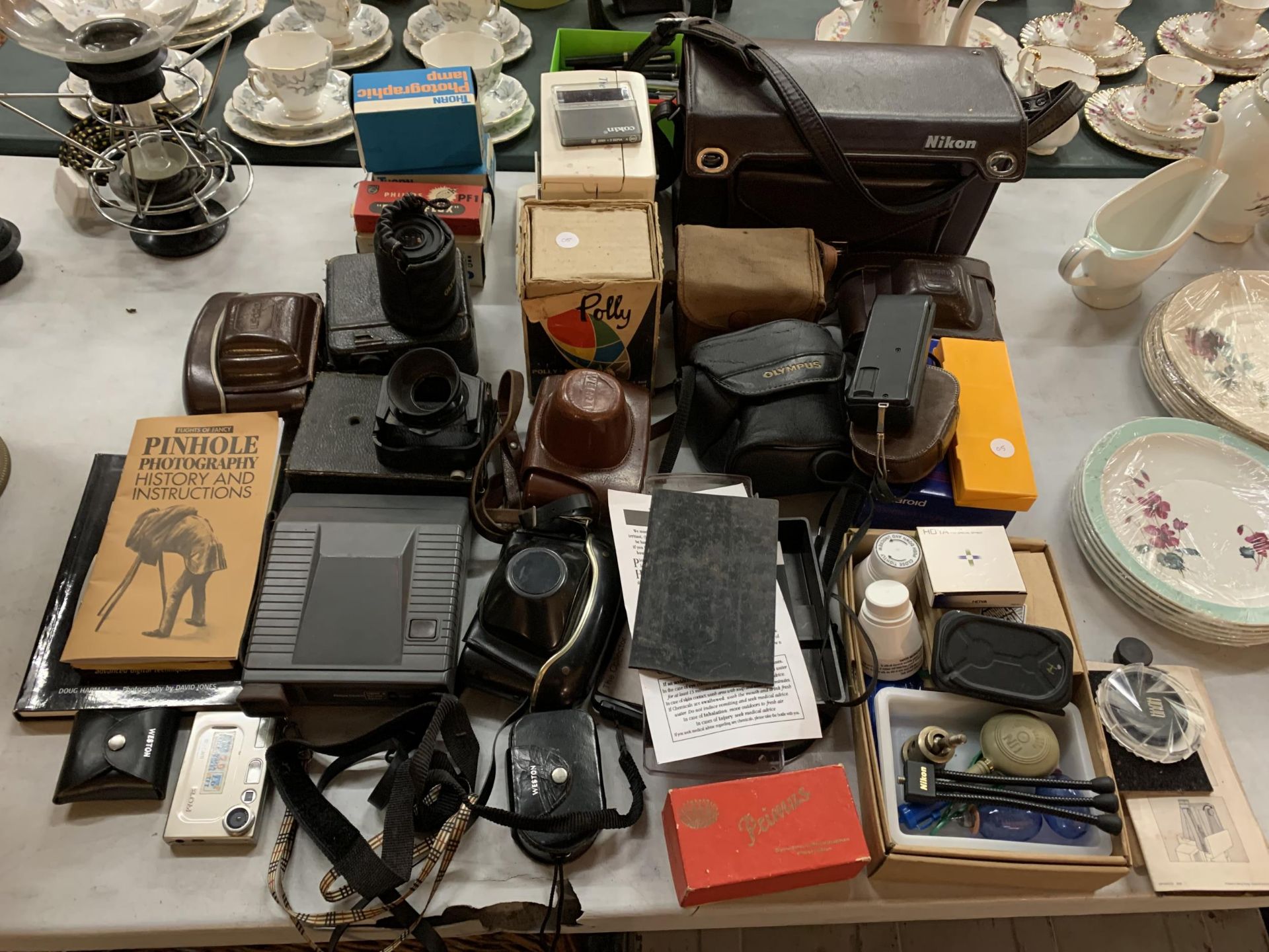 A VERY LARGE AMOUNT OF CAMERAS AND ACCESORIES TO INCLUDE A JUNIOR BROWNIE, ILFORD, OLYMPUS, FLASHES,