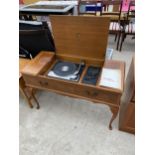 A DYNATRON WALNUT RADIOGRAM WITH GARRARD DECK