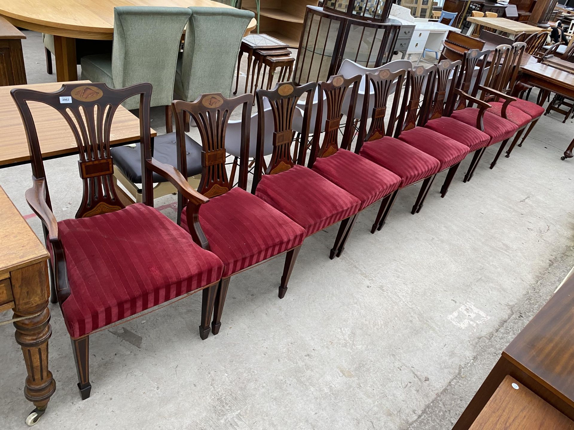 A SET OF EIGHT EDWARDIAN MAHOGANY AND SHELL INLAID CHAIRS, TWO BEING CARVERS