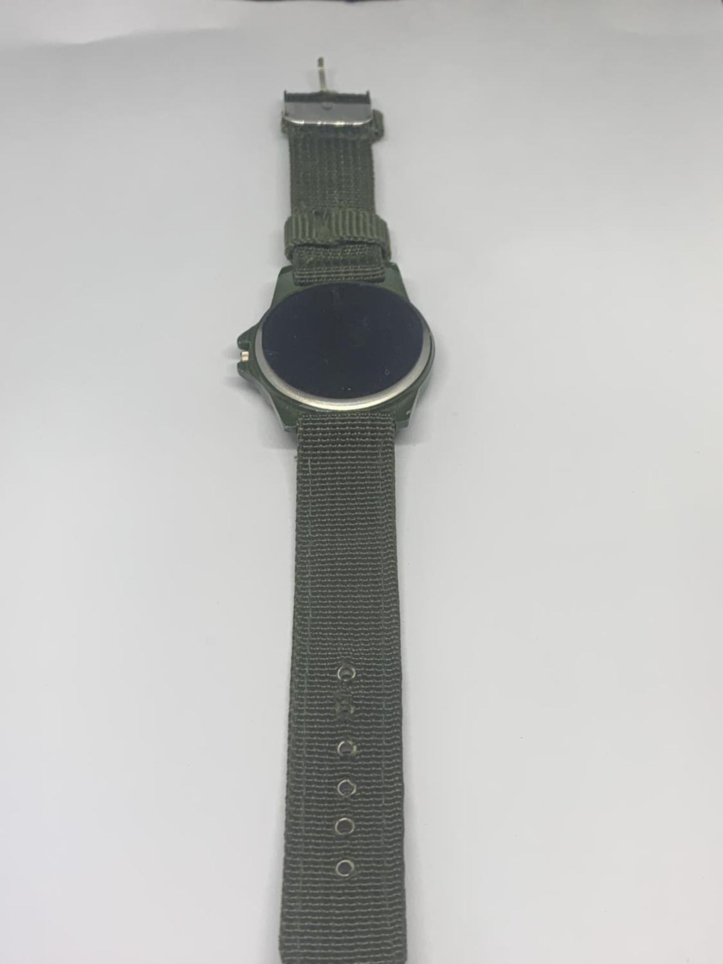 A SWISS ARMY WRISTWATCH WITH GREEN CANVAS STRAP SEEN WORKING BUT NO WARRANTY - Image 3 of 3