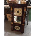 A VINTAGE STYLE WOODEN CASED WALL CLOCK WITH COLUMNS AND FLORAL DECORATED FRONT, COMPLETE WITH