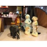 A WOODEN ELEPHANT, TWO CERAMIC CONTINENTAL STYLE FIGURES , ETC