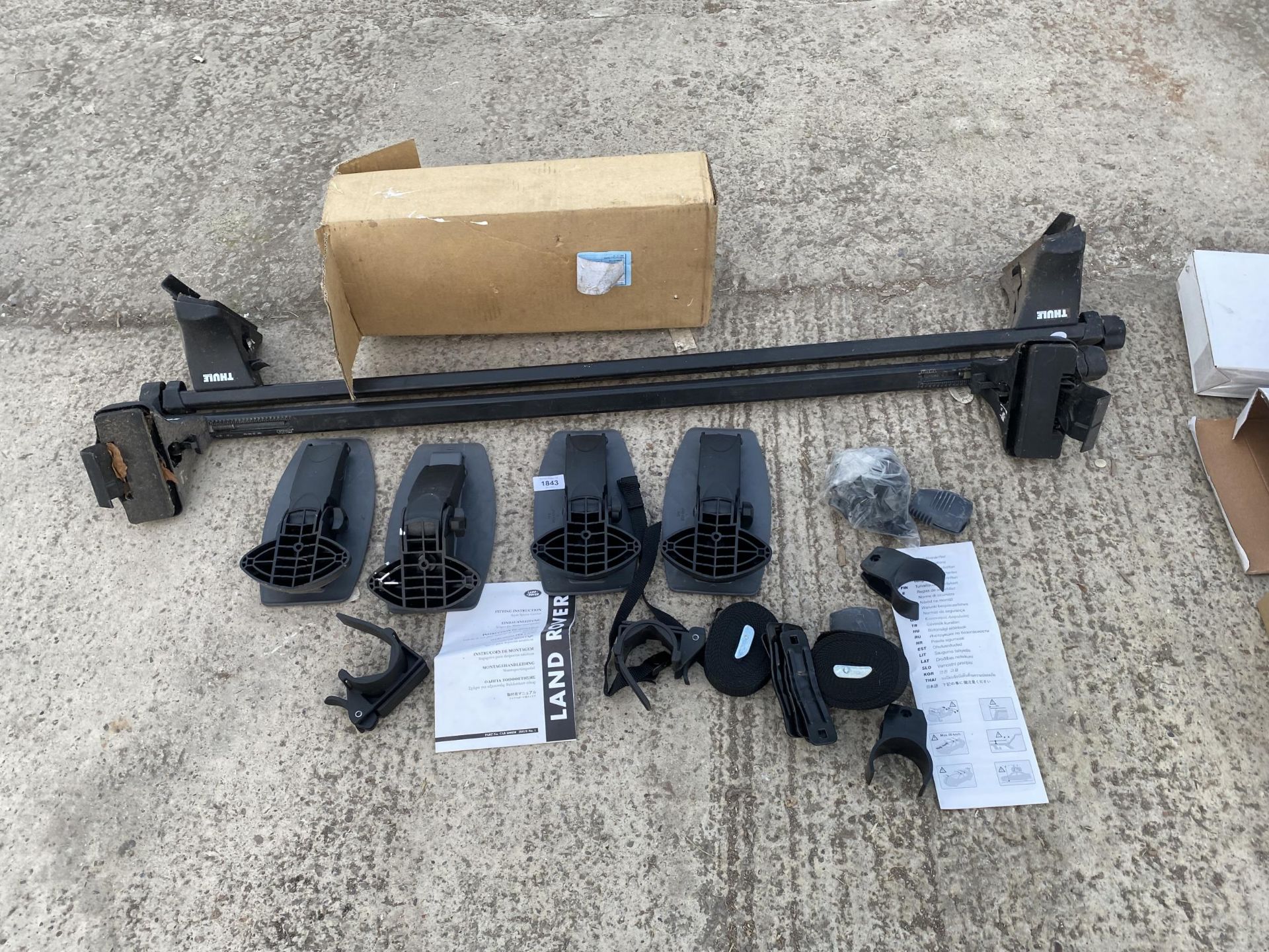 AN ASSORTMENT OF THULE ROOF RACK ITEMS