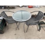 A GARDEN BISTRO SET TO INCLUDE A GLASS TOPPED TABLE AND TWO WICKER EFFECT METAL FRAMED CHAIRS