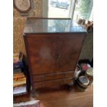 A WALNUT TALLBOY WITH TWO DOORS ABOVE TWO DRAWERS