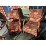 TWO OAK FRAMED ARMCHAIRS WITH FLORAL UPHOLSTERY
