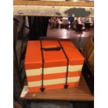 AN ORANGE AND CREAM RETRO STACKING PICNIC BOX