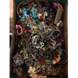 A LARGE AMOUNT OF COSTUME JEWELLERY TO INCLUDE BANGLES, BEADS, NECKLACES, ETC