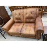 A MODERN LEATHER TWO SEATER SETTEE