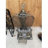 AN ASSORTMENT OF ITEMS TO INCLUDE A HEAVY AND ORNATE BRASS FIRE SCREEN, A BRASS TRIVET STAND AND A