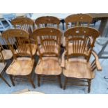 A SET OF SIX AMERICAN STYLE DINING CHAIRS WITH TURNED SPINDLES, CARVED TOP AND BOTTOM RAILS, TWO