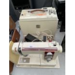 A RETRO NEW HOME SEWING MACHINE WITH FOOT PEDDLE AND CARRY CASE