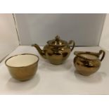 THREE PIECES OF GRAYS GOLD COLOURED POTTERY TO INCLUDE A TEAPOT, JUG AND SUGAR BOWL