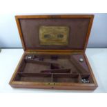 AN OAK CASED BOX SUITABLE FOR A WEBLEY 'WEDGE' REVOLVER, 22CM X 39CM