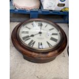 A WOODEN CASED CIRCULAR WALL CLOCK