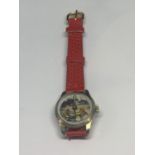 A CHILDS SEE SAW WRIST WATCH