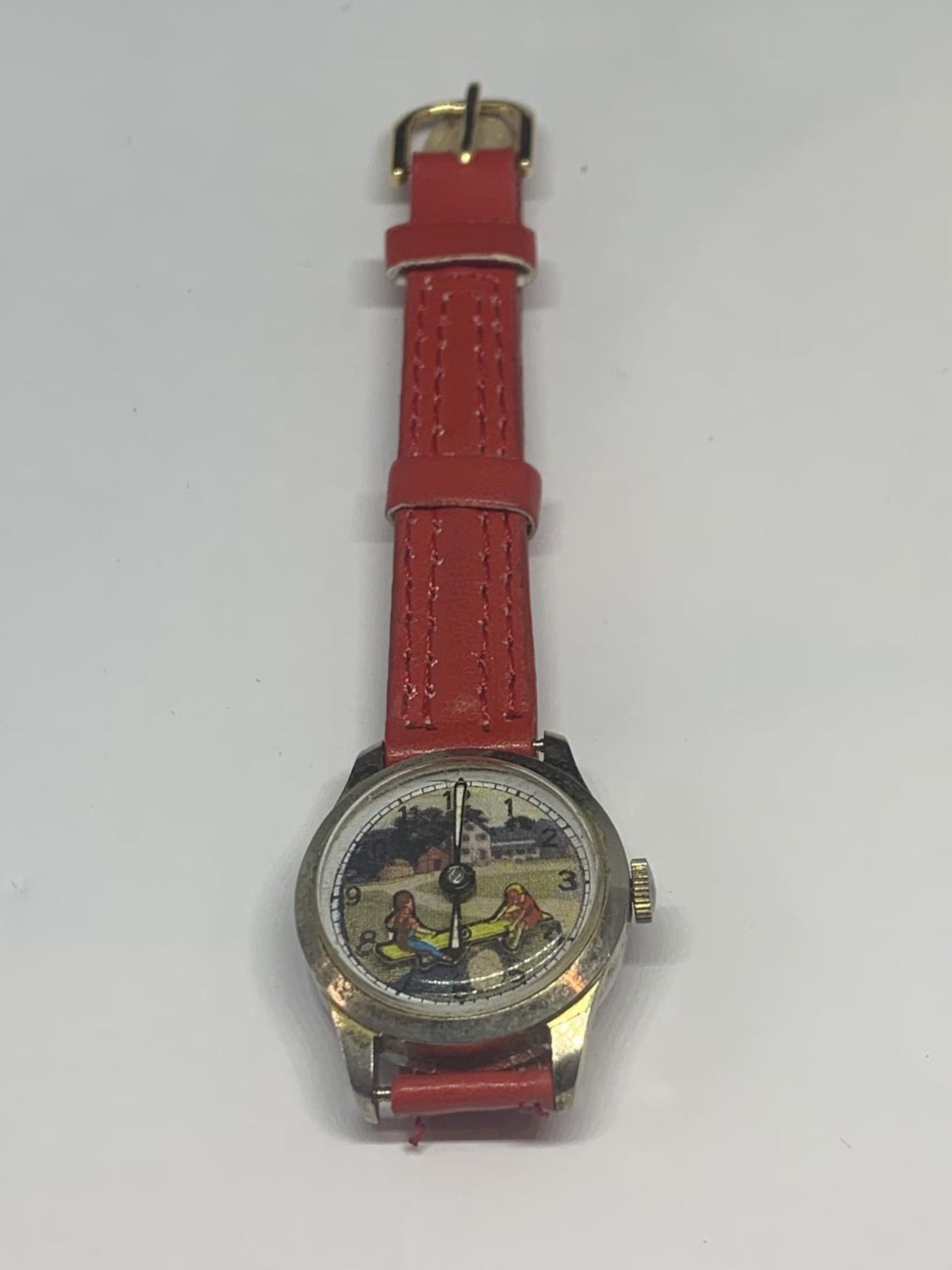 A CHILDS SEE SAW WRIST WATCH