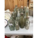 A LARGE ASSORTMENT OF VINTAGE CLEAR GLASS BOTTLES