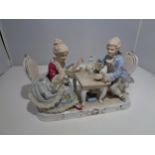 A VICTORIAN DRESDEN DOUBLE FIGURE OF A LADY AND GENT PLAYING CARDS