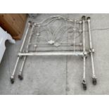 A DECORATIVE VINTAGE WROUGHT IRON BED HEAD AND FOOT BOARD