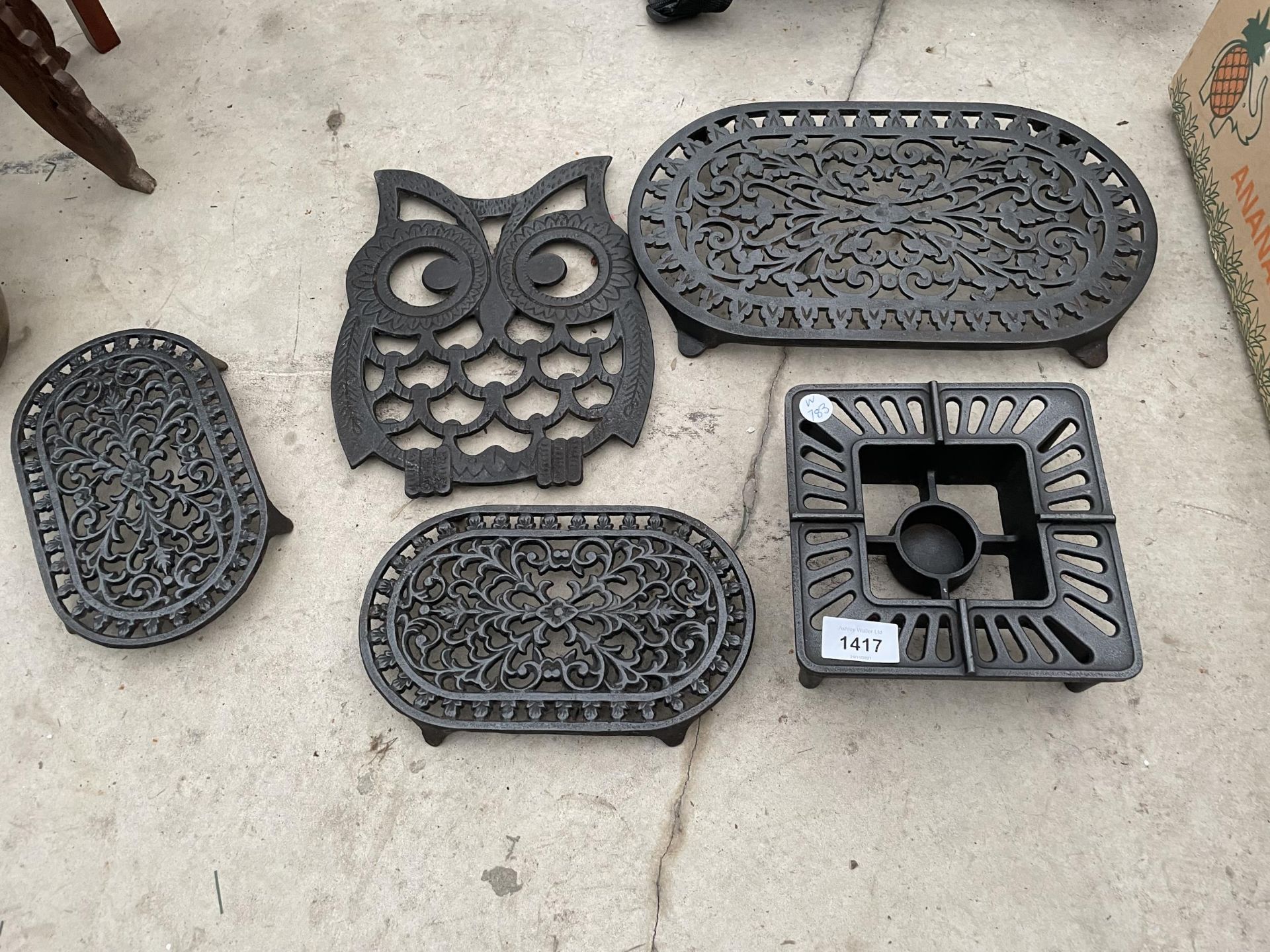 AN ASSORTMENT OF DECORATIVE TRIVET STANDS