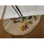 AN OVAL TAPESTRY RUG