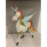 A BRIGHTLY COLOURED TIN UNICORN, HEIGHT 50CM