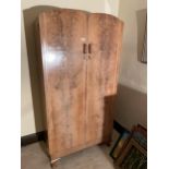 A WALNUT TWO DOOR WARDROBE ON CABRIOLE SUPPORTS