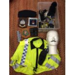 A COLLECTION OF POLICE ITEMS TO INCLUDE BADGES, PLAQUES, VESTS, HANDCUFFS ETC