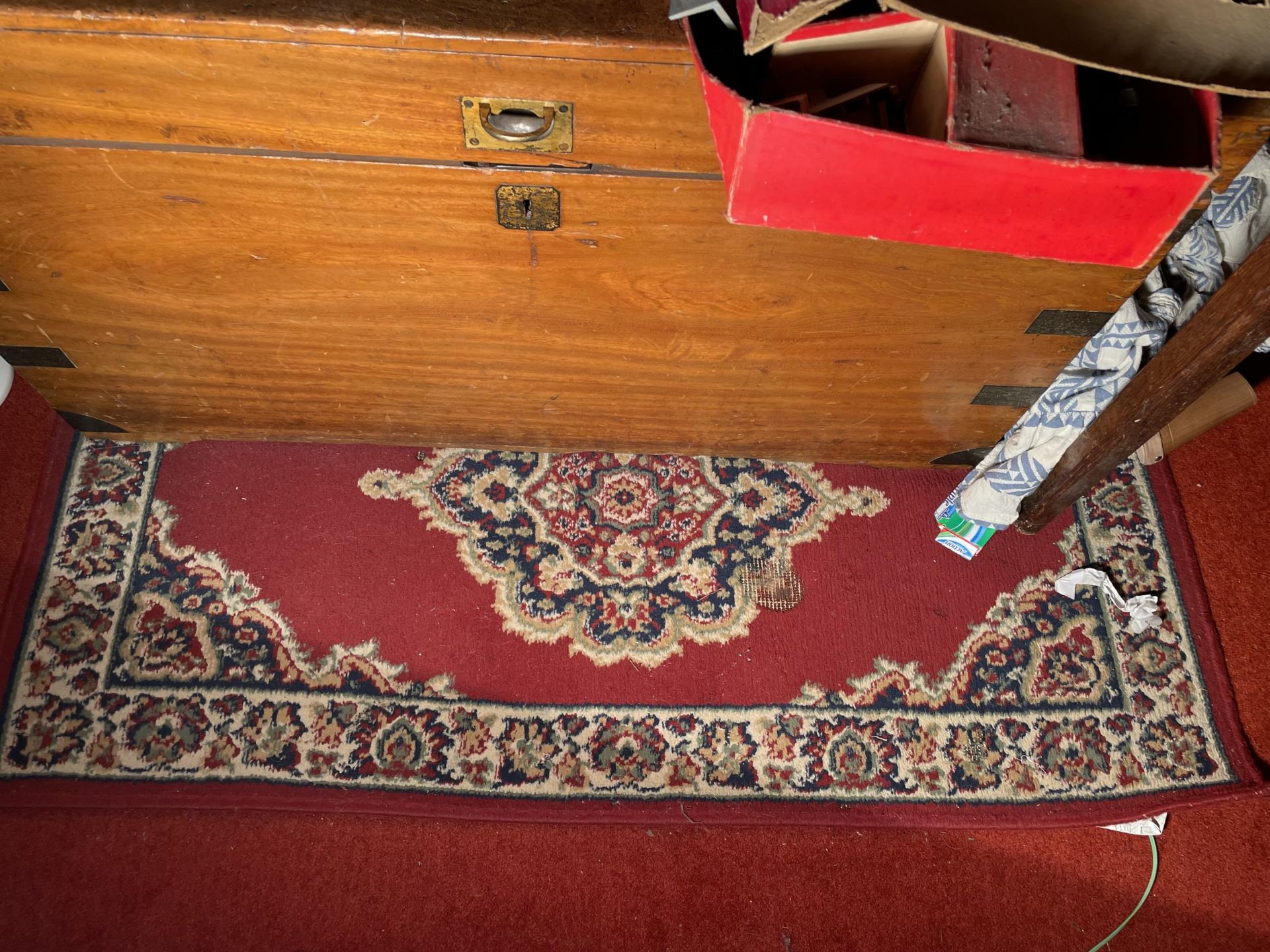 A RED PATTERNED RUG