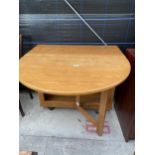 A MODERN OAK DROP-LEAF TABLE