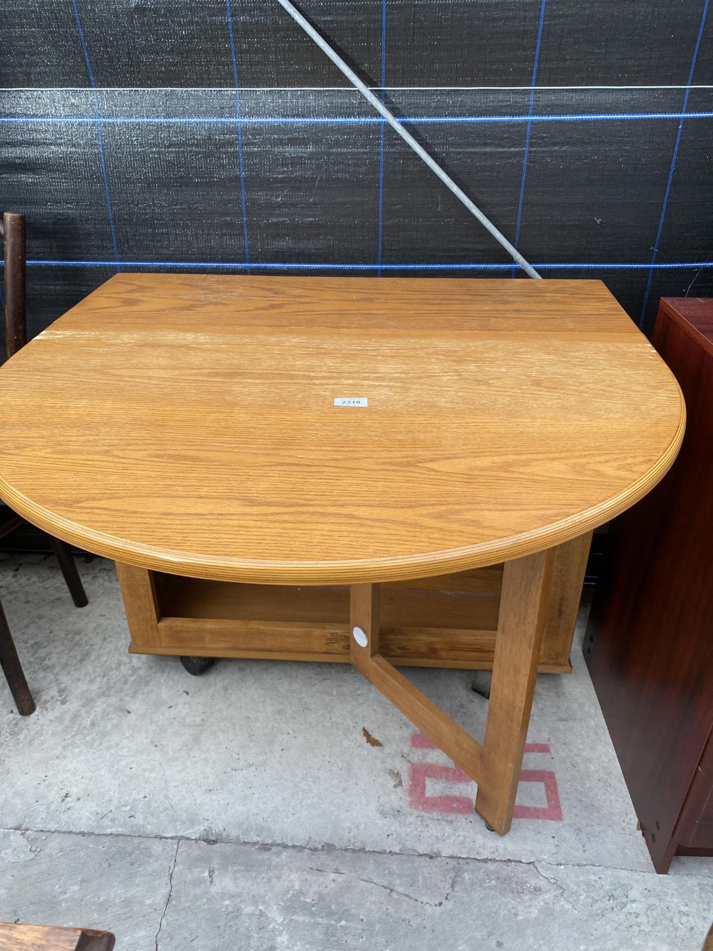 A MODERN OAK DROP-LEAF TABLE