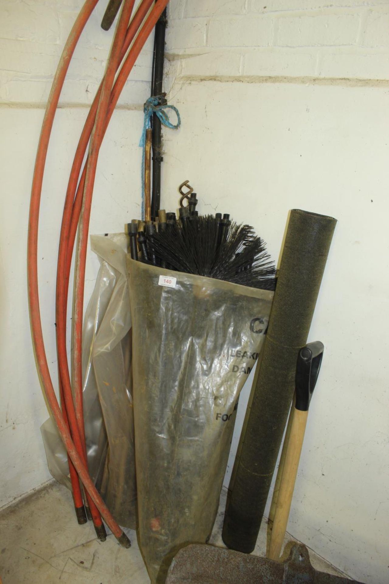 A SET OF CHIMNEY SWEEP RODS AND A BRUSH AND FOUR DRAINING RODS