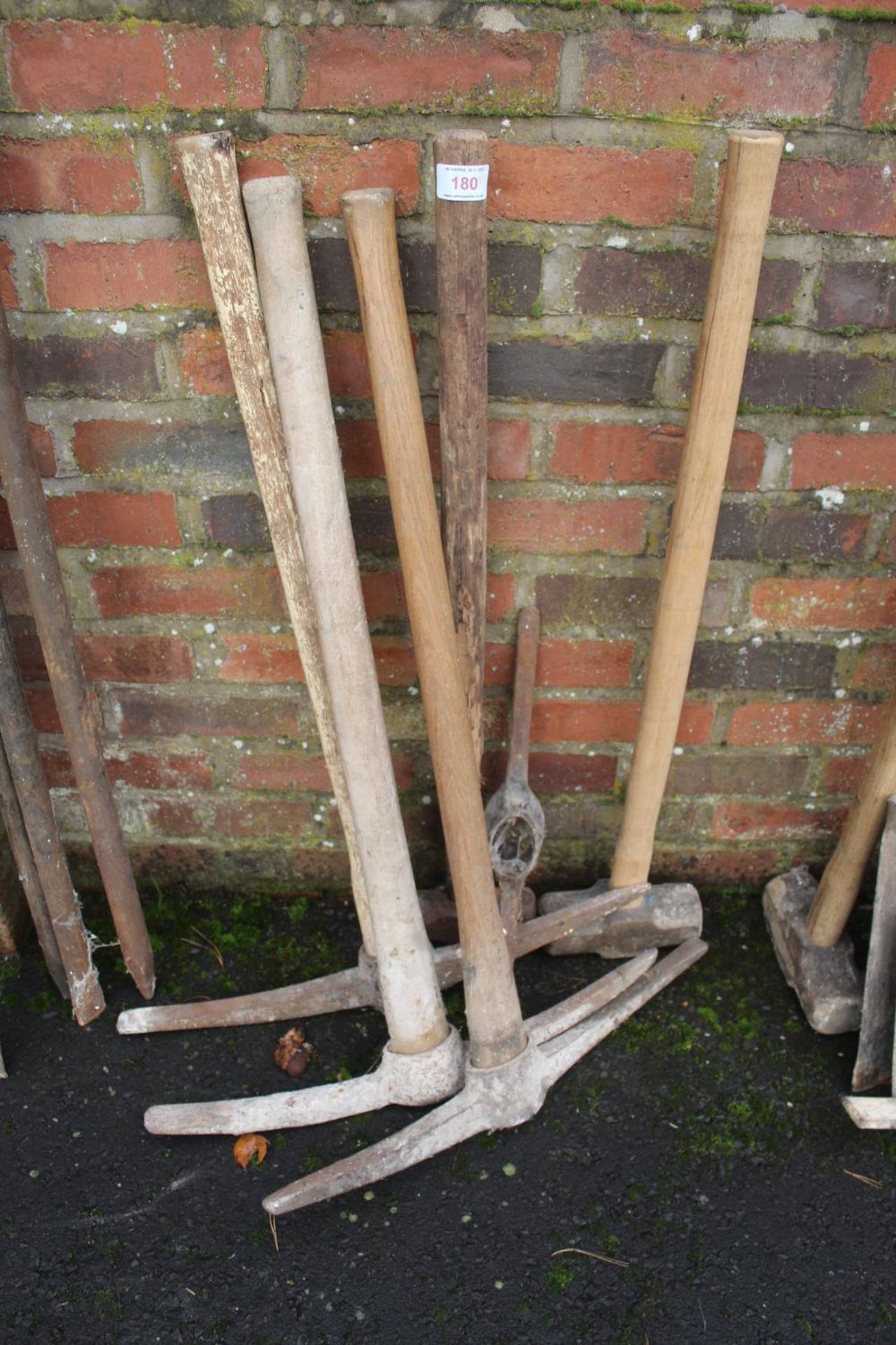 FOUR PICK AXES AND TWO SLEDGE HAMMERS