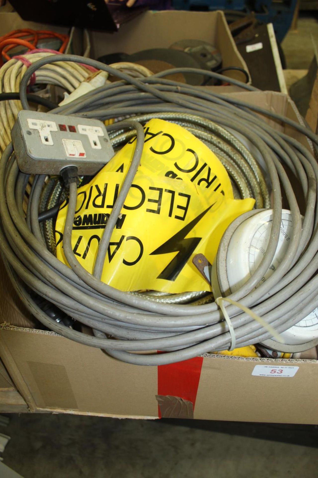 A BOX CONTAINING A QUANTITY OF CABLES AND A NORMOND DIESEL GAUGE