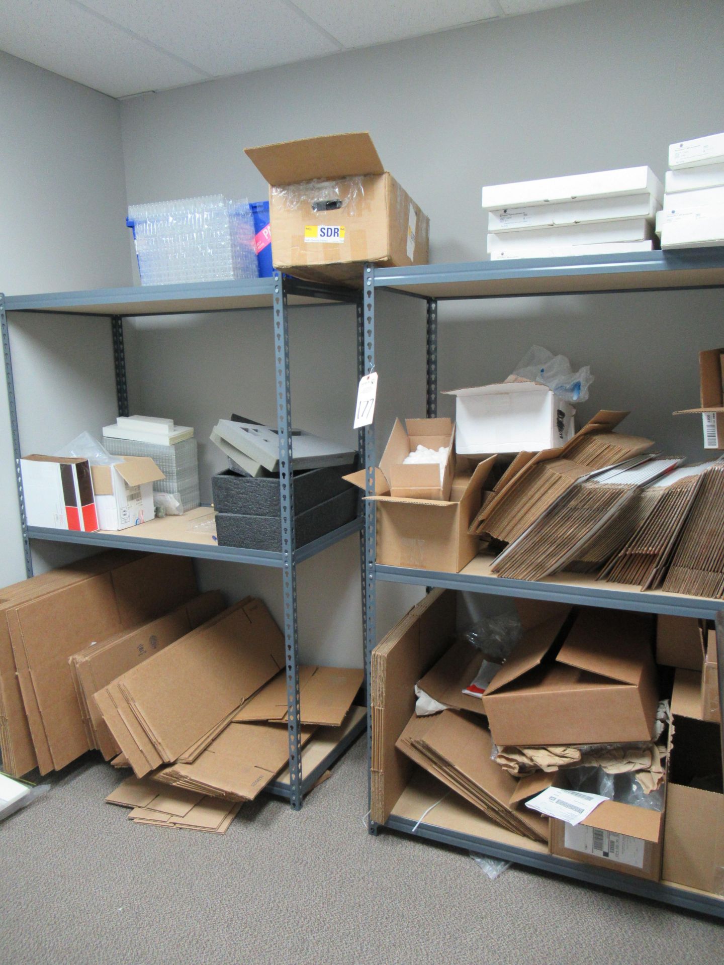 (2) Steel Racks with Assorted UPS, FedEx & Unmarked Disassembled Cardboard Boxes