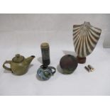 A collection of studio pottery including a teapot, small jug, and usual bust shape vase A/F