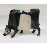 A Lawson E Rudge Raku pottery sculpture of a cow, leg A/F. Length approx. 45cm