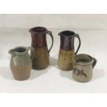 A collection of four studio pottery jugs