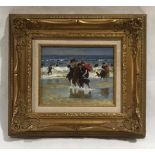 A framed unsigned impressionist oil on board of a Edwardian style beach scene. Overall size 39cm x
