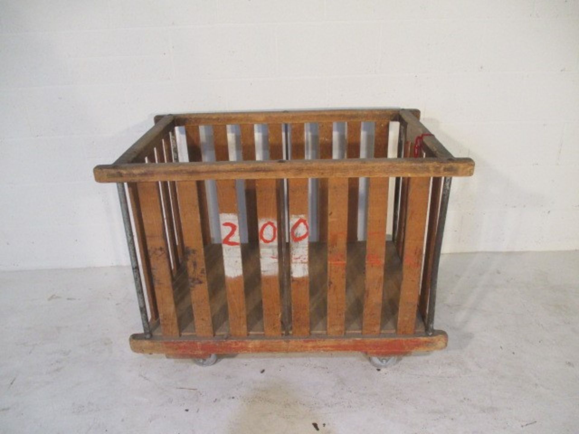 A slatted wooden bobbin trolley - length 109cm, width 70cm