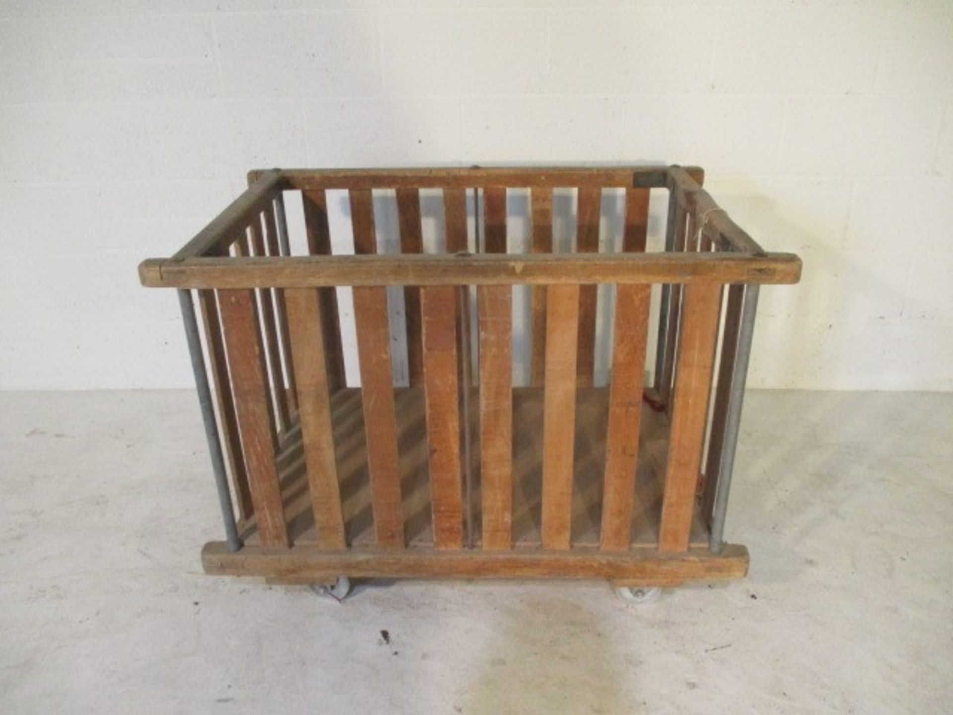 An industrial slatted wooden bobbin trolley - length 109cm, width 70cm