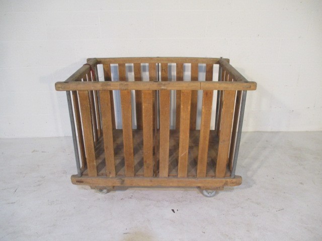 A slatted wooden bobbin trolley - length 108cm, width 70cm