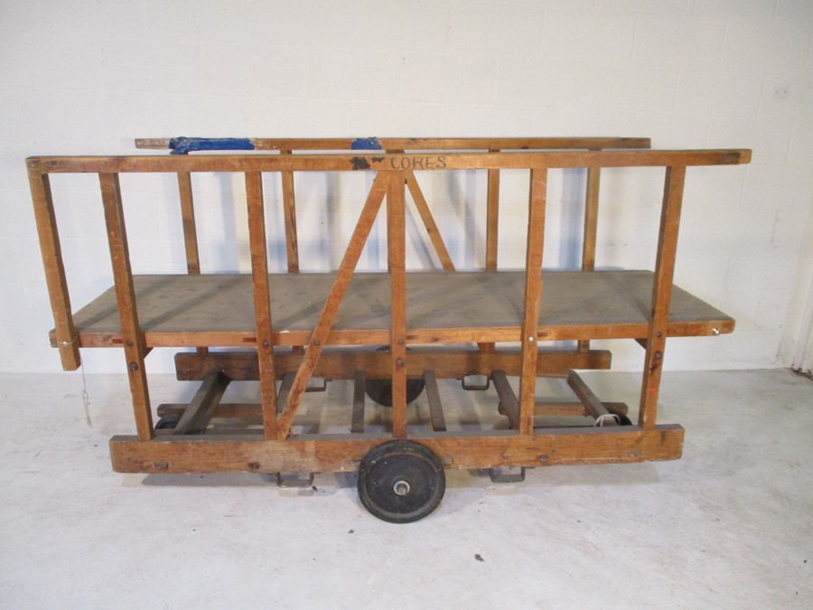 An industrial wooden trolley with platform