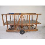 An industrial wooden trolley with platform