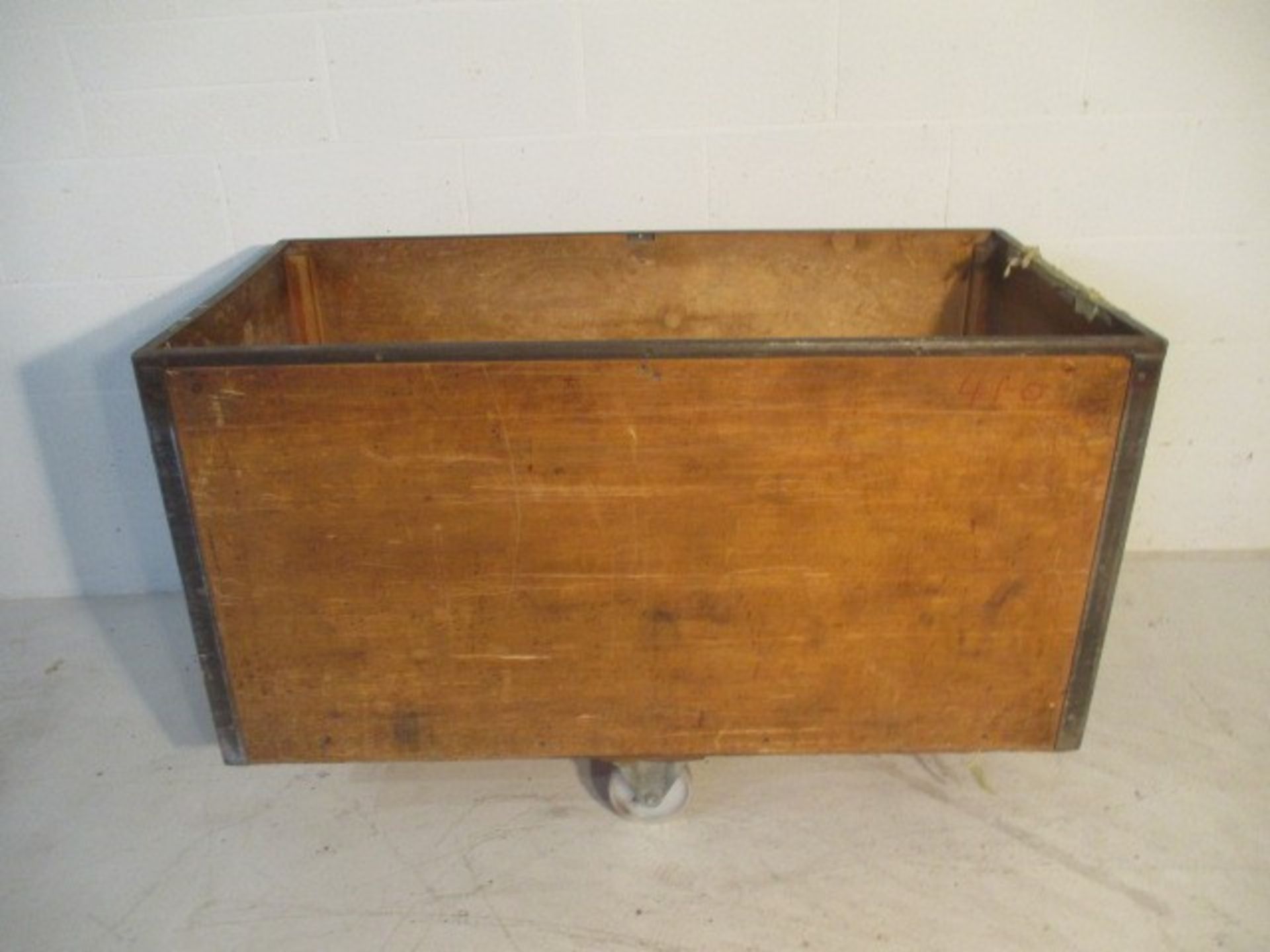 A wooden trolley with metal edging, 123 cm x 62 cm