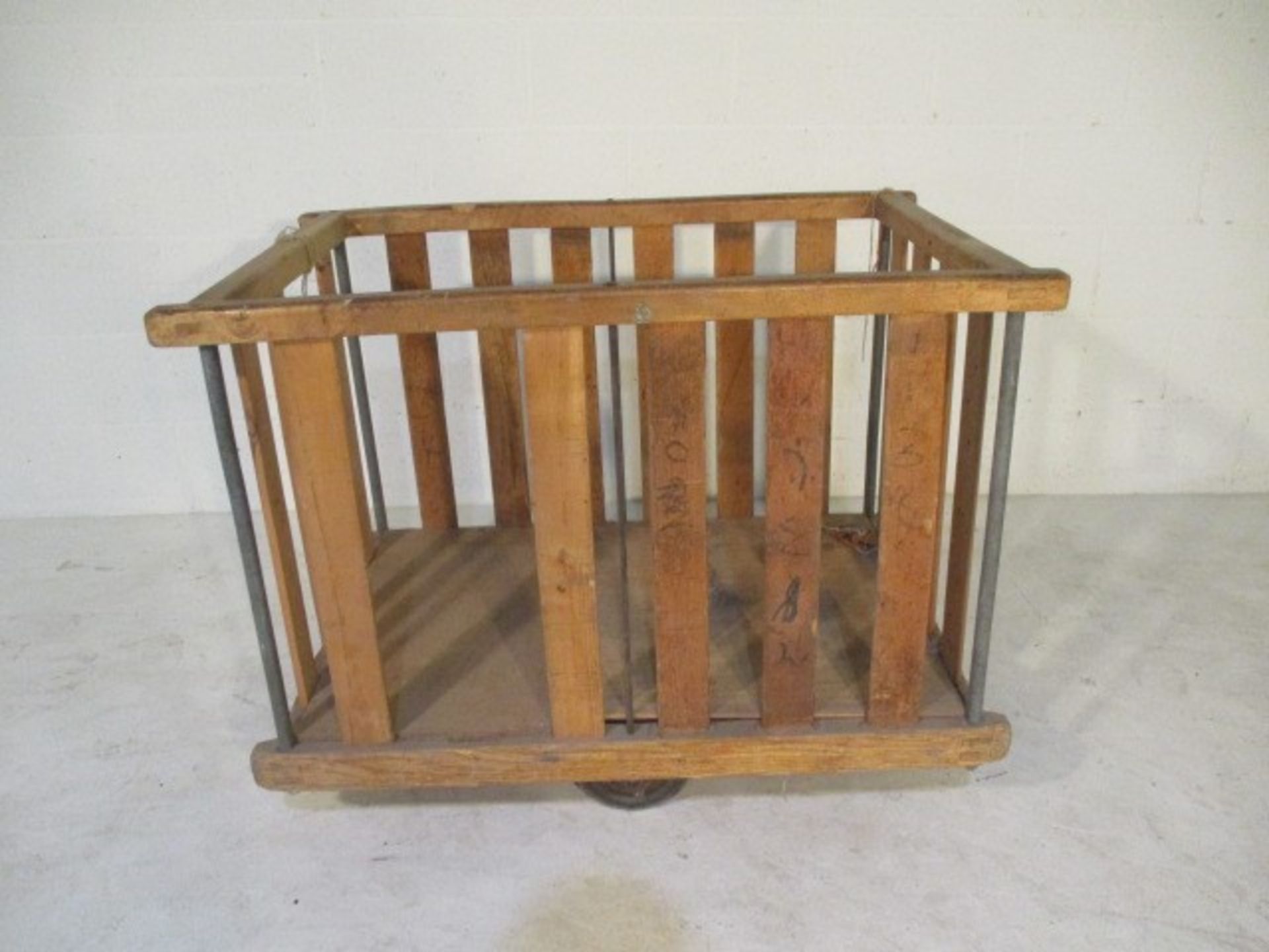 A slatted wooden bobbin tilt trolley - length 108cm, width 71cm