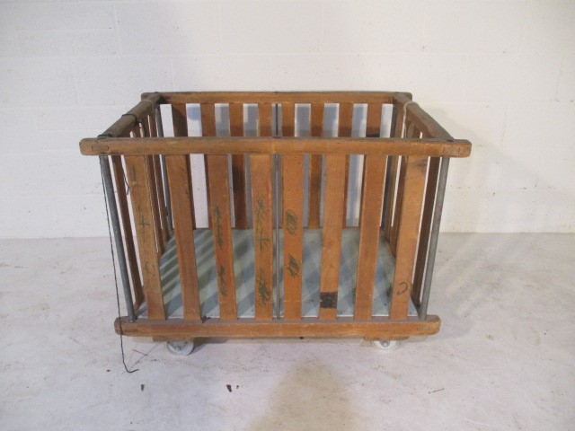 A slatted wooden bobbin trolley - length 108cm, width 70cm