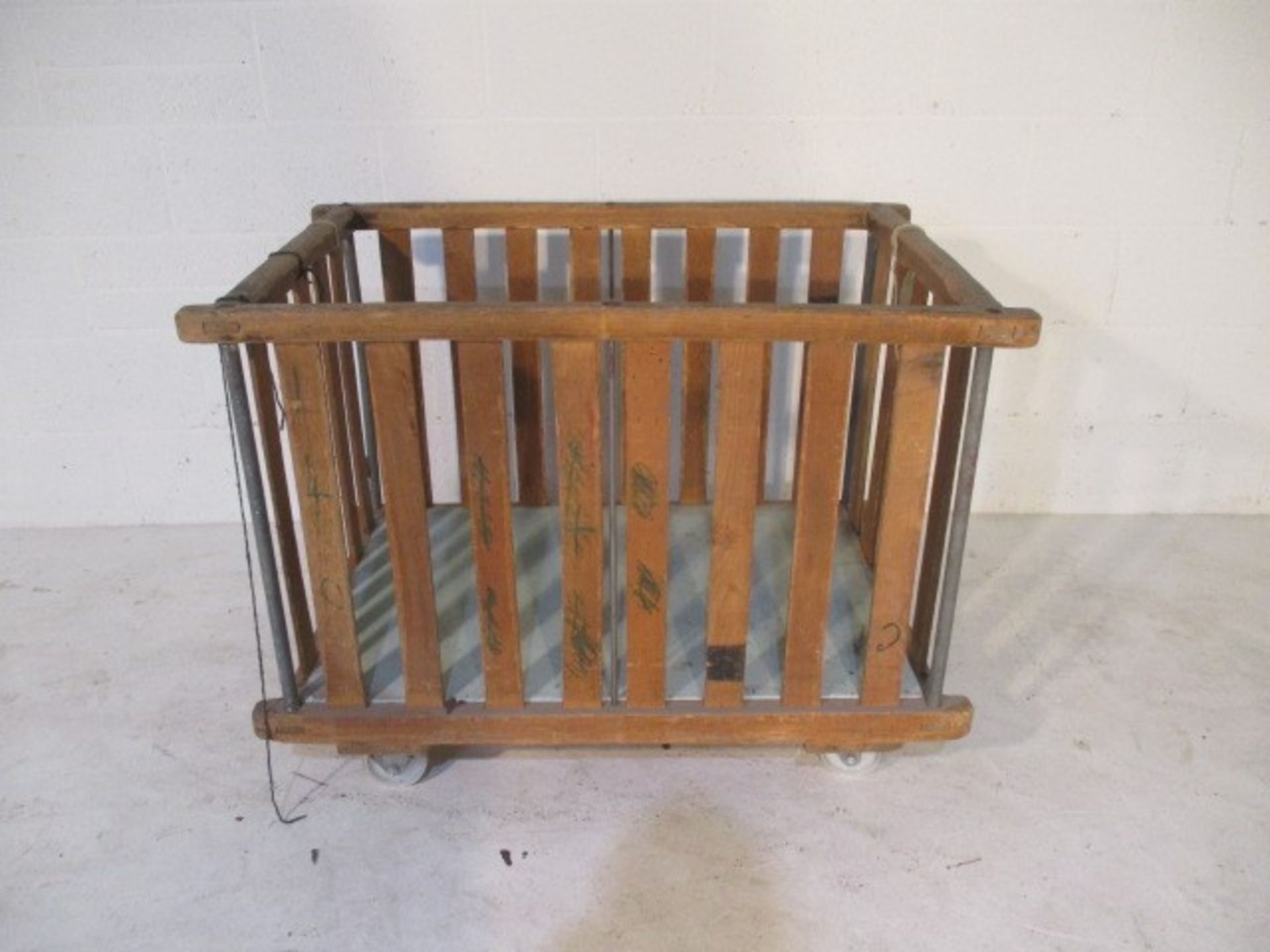 A slatted wooden bobbin trolley - length 108cm, width 70cm