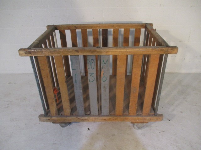 A slatted wooden bobbin trolley - length 109cm, width 70cm